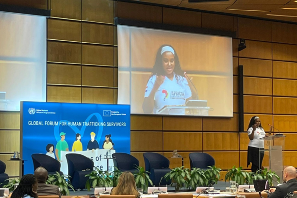 Malaika Oringo giving a presentation at Global Forum for Human Trafficking